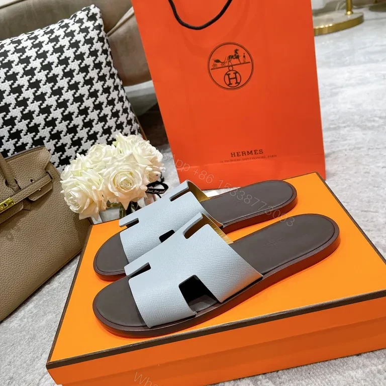 View 2 of Ice-Blue Hermes Oran Slides: Clean, Confident Comfort