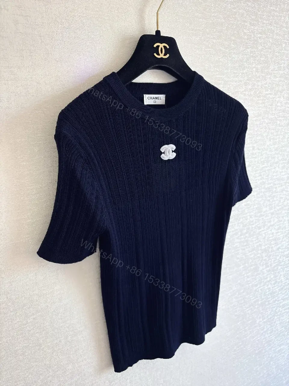 View 5 of Navy Knit Tee: Ribbed Texture, Subtle Crest Emblem, Luxe Casual