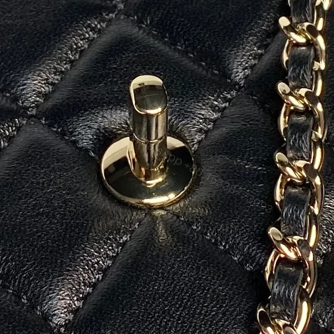 View 7 of Quilted Black Flap Bag with Gold Chain Strap, Compact, Elegant