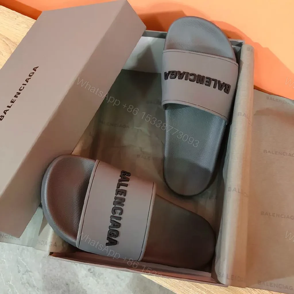 View 9 of Minimalist Designer Slides in Neutral Faux Leather with Bold Logo Strap