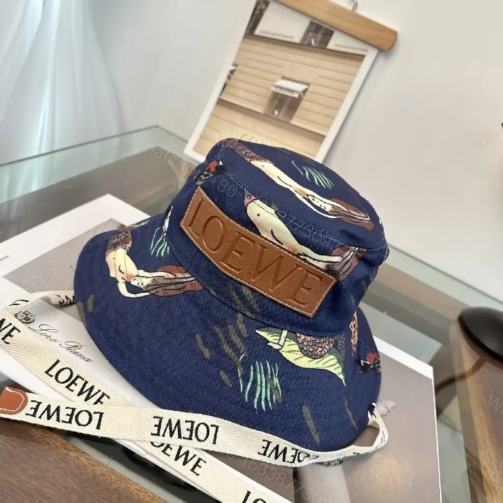 View 3 of Navy Floral Canvas Bucket Hat with Leather Brand Patch