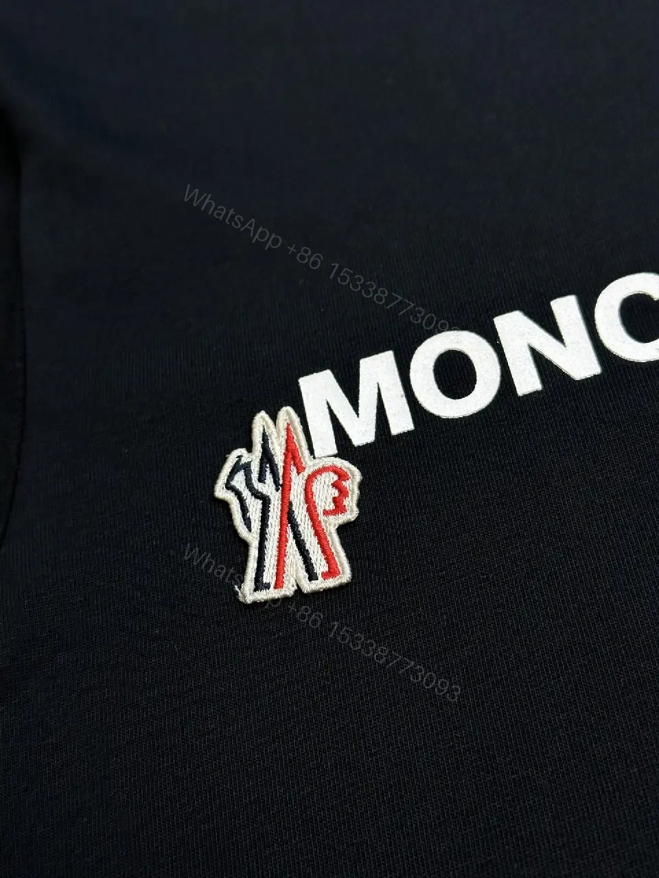 View 7 of Minimalist Black Tee with Logo Crest, Relaxed Fit, Premium Cotton