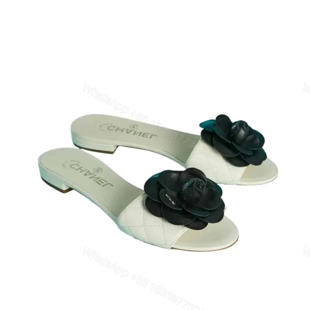 Chanel Black Camellia Slides White — view 1