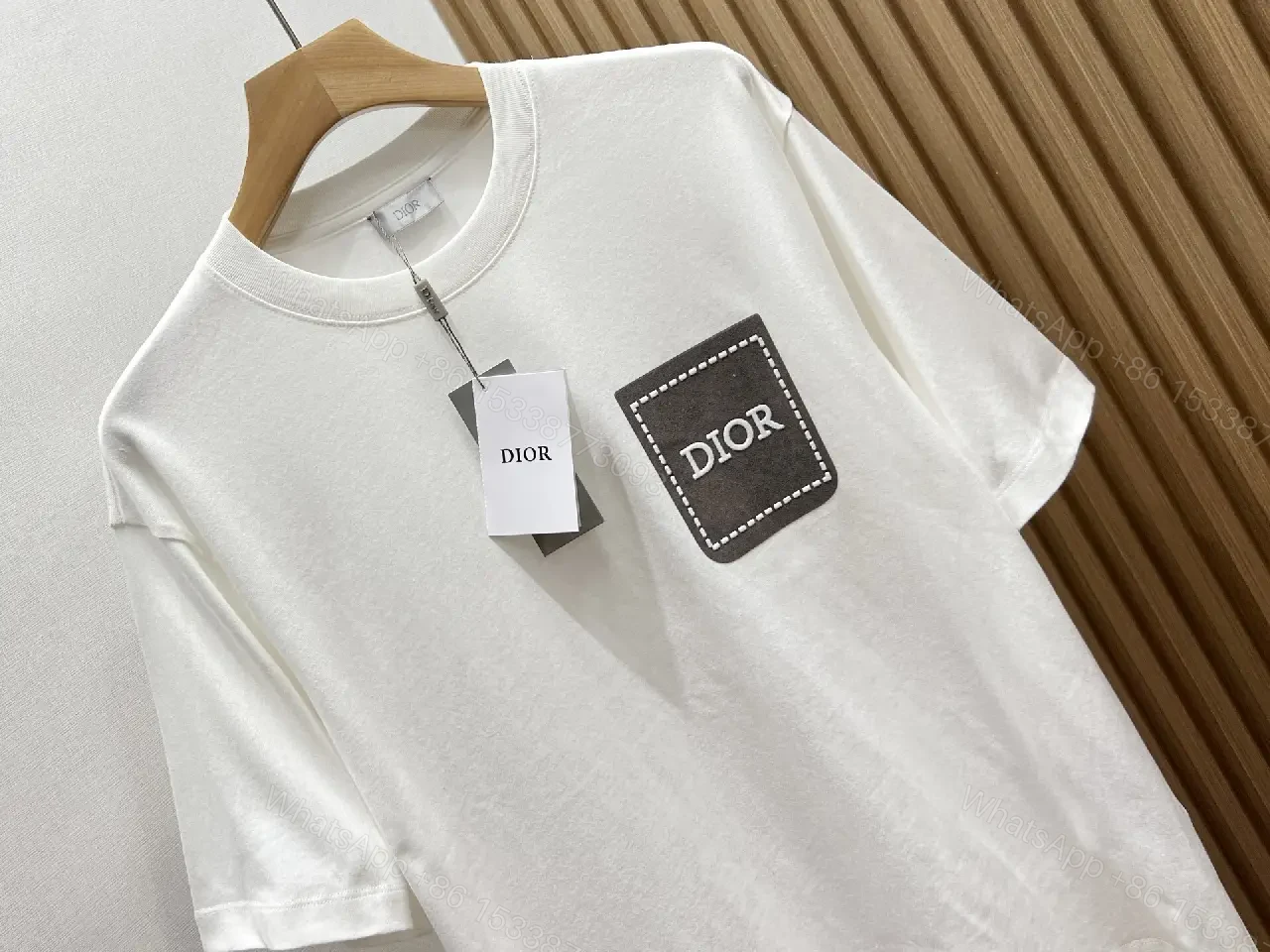 View 2 of Minimalist White Tee with Dior Pocket: Subtle Luxury T-Shirt