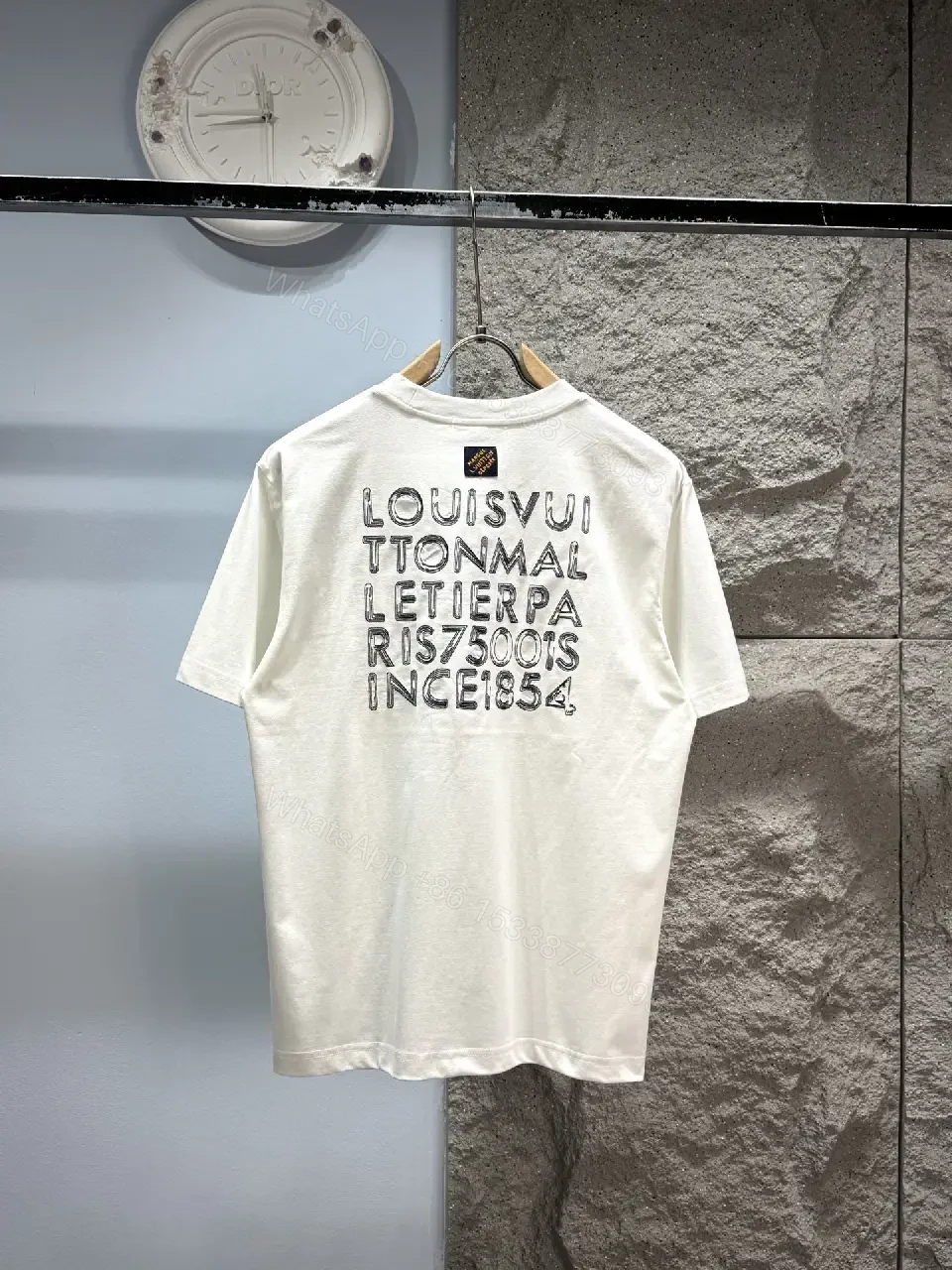 View 4 of Minimalist White Tee with Subtle L.V.M. Logo—Premium Everyday Essential