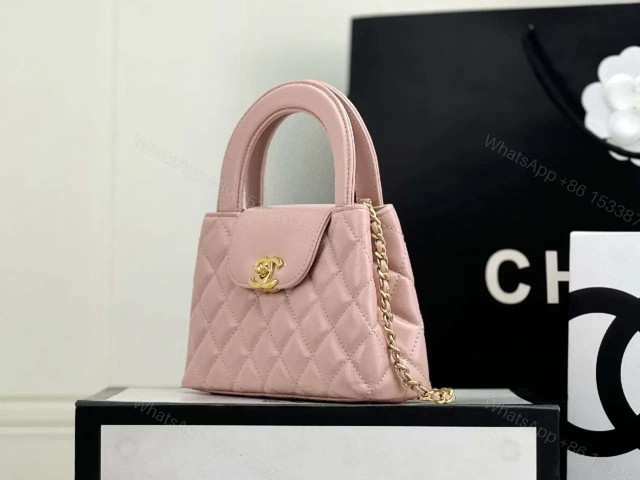View 2 of Soft Pink Quilted Mini Bag with Gold Hardware, Elegant Twist, Mini Bag