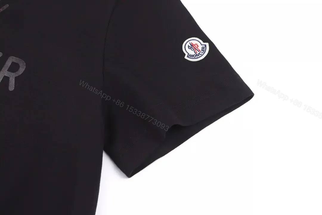 View 8 of Matte Black Cotton Tee with Subtle Embossed Logo, Modern Comfort
