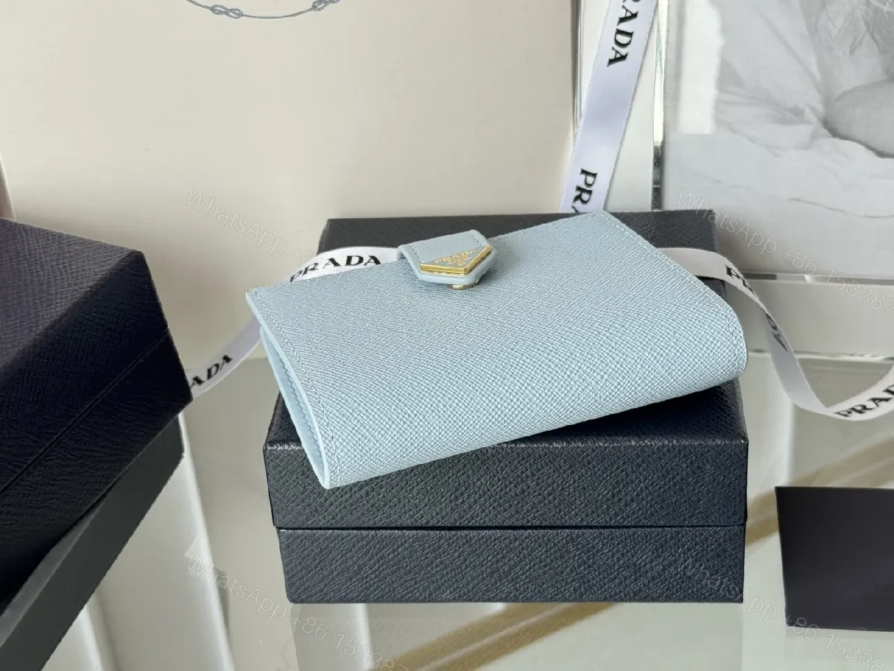 View 10 of Blue Saffiano-Like Bifold Wallet with Triangle Closure, Minimal Luxury