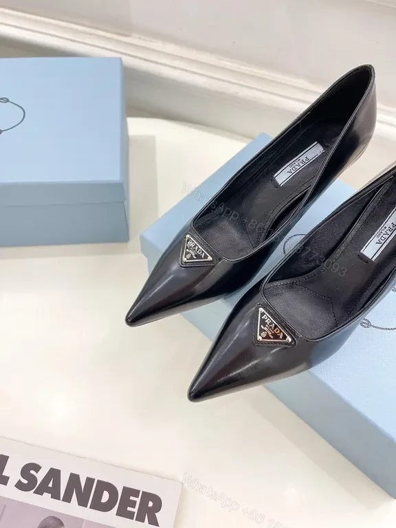 View 9 of Sleek Black Leather Pumps - Prada Hardware Chelsea-Style Pumps