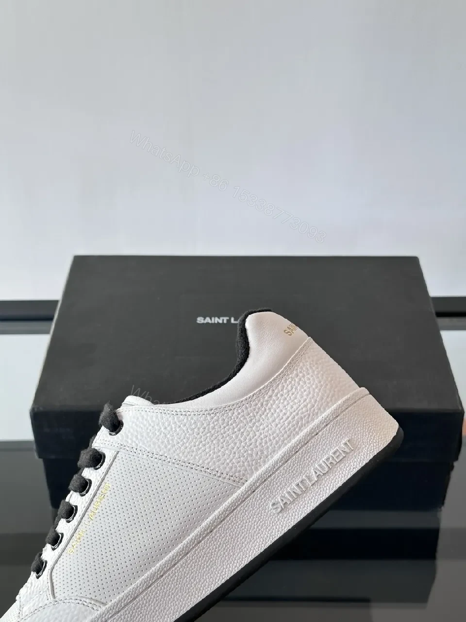 View 4 of White Leather Sneaker with Black Accents — Minimalist Luxury Sneaker
