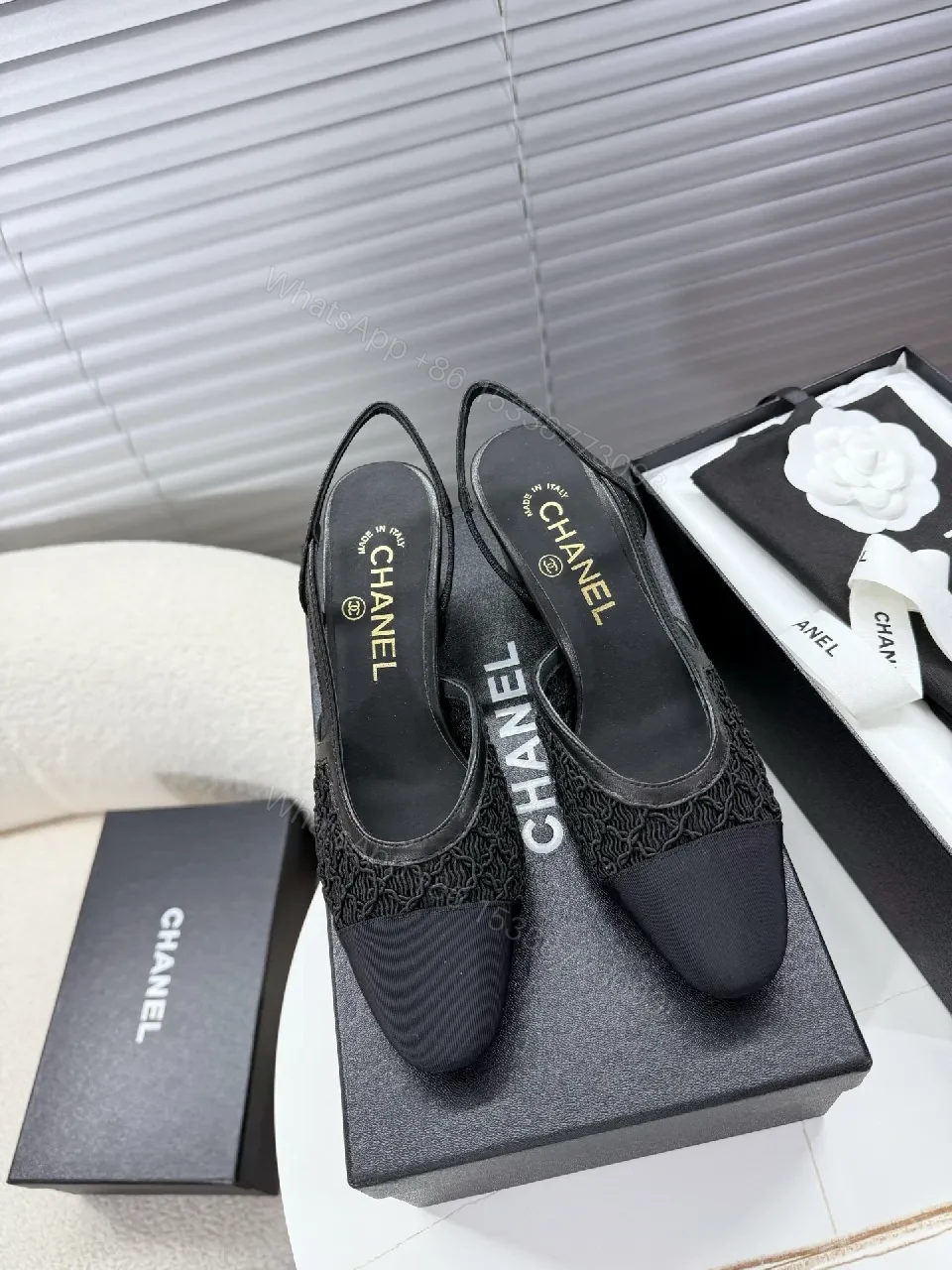 Chic Black Mesh Slingback: Textured Luxury Slip-Ons — view 1