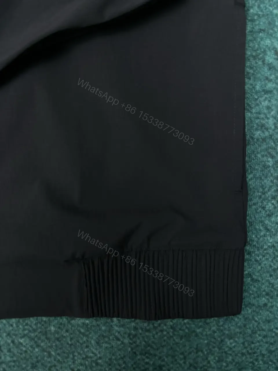 View 4 of Black Shell Bomber Jacket - Minimalist Luxury, Subtle Branding, Lightweight Warmth