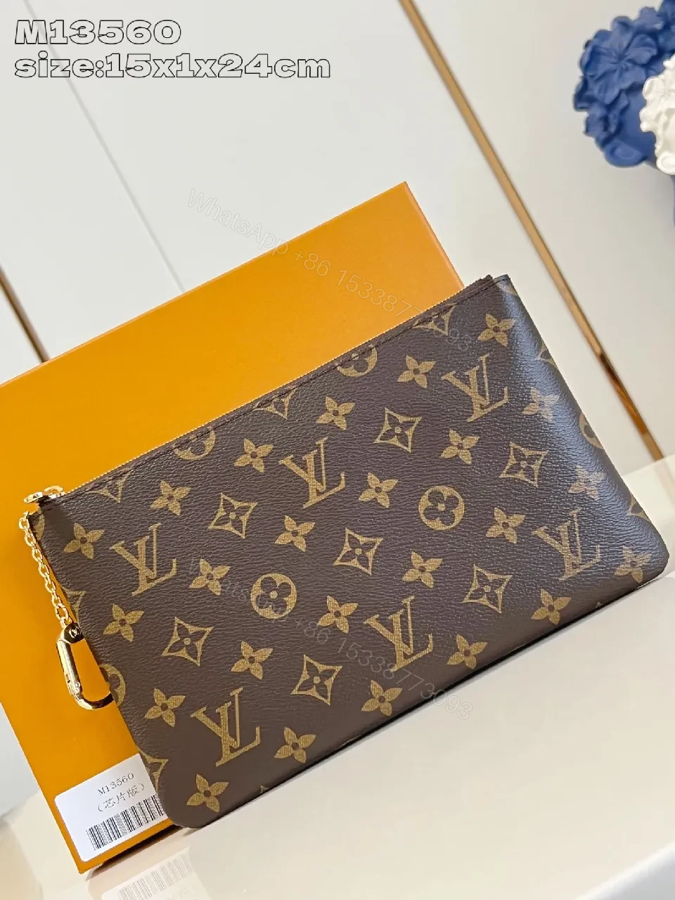Chocolate + Coated Canvas + Clutch / Chain + Monogram Accent + Clutch — view 1