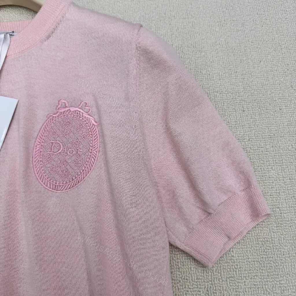 View 9 of Soft Pink Knit Top with Crest – Elegant Everyday Essential