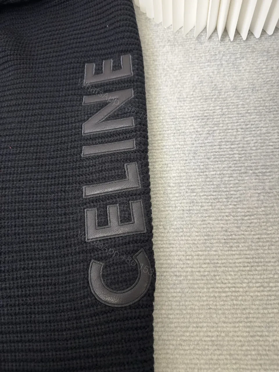 View 7 of Chunky Knit Hoodie in Deep Black with Subtle Logo Embossing, Modern Luxe