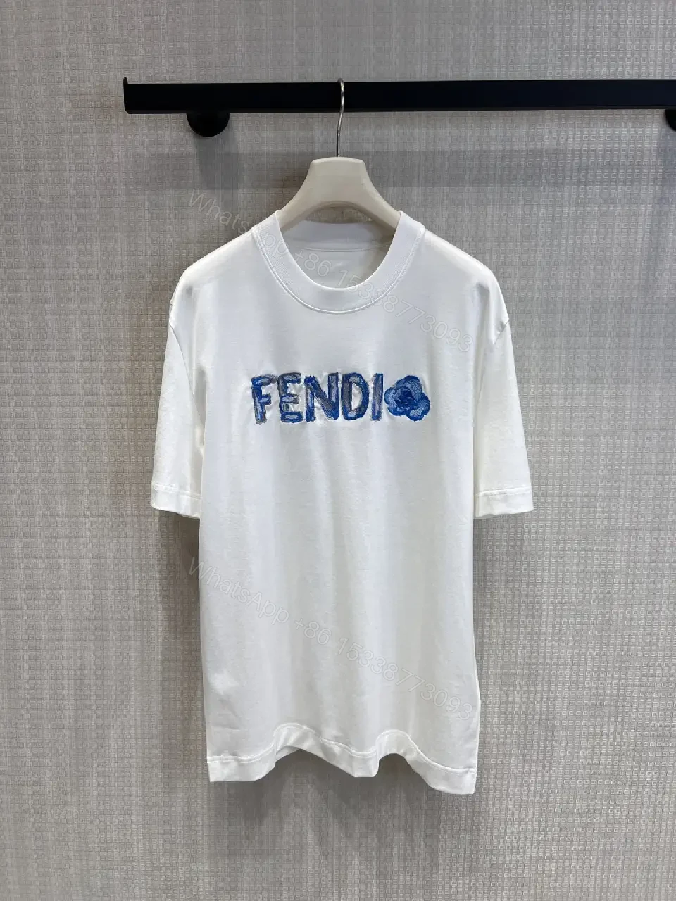 View 3 of Minimalist White Tee with Luxe Embroidered Logo, Casual-Ready Top