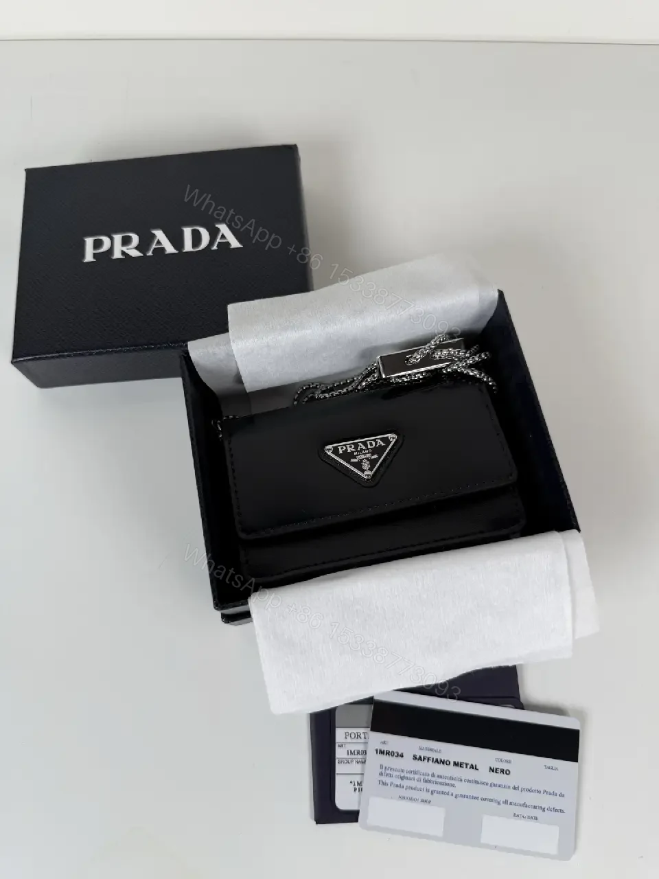 View 5 of Chic Black Leather Mini Bag with Signature Logo Chain