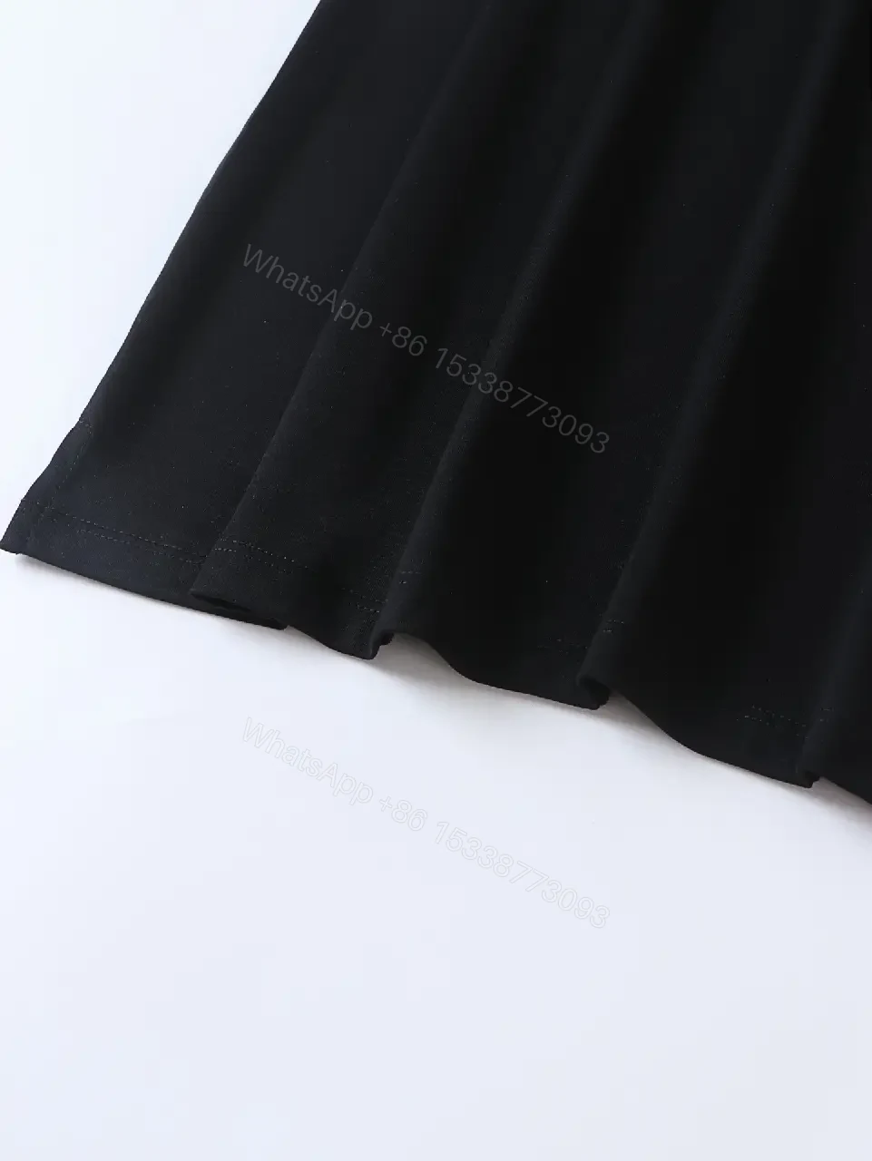 View 7 of Minimalist Black Cotton Tee: Logo-Embossed Luxury Top
