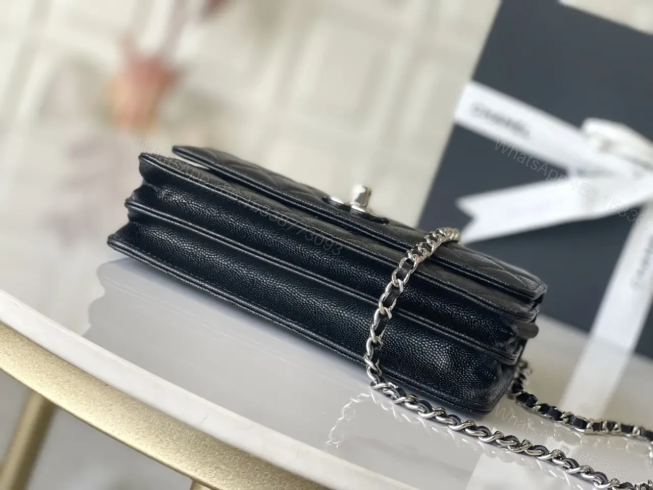 View 6 of Black Quilted Leather Mini Bag - Chain Handle, Compact Luxury