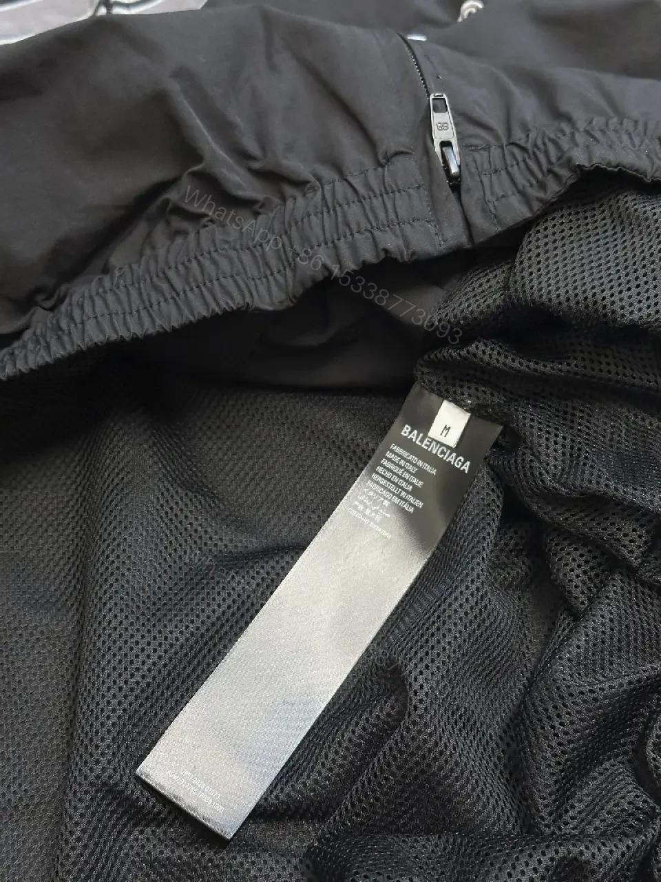 View 10 of Black Nylon Windbreaker Modern Logo-Driven Streetwear Jacket