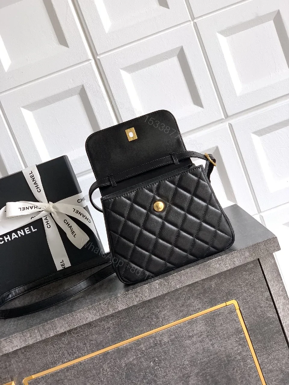 View 6 of Compact Quilted Black Camera Bag with Gold Hardware