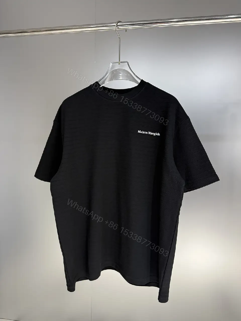 View 4 of Black Cotton Crewneck Tee + Minimalist Style + Subtle Logo + All-Day Comfort + T-Shirt