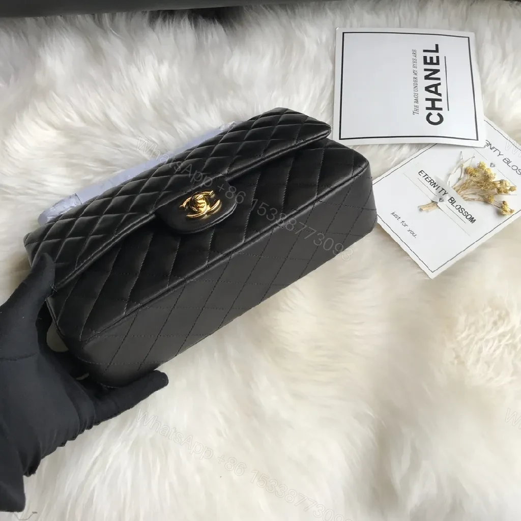 View 8 of Quilted Black Handbag with Gold Clasp – Luxe Chic Style
