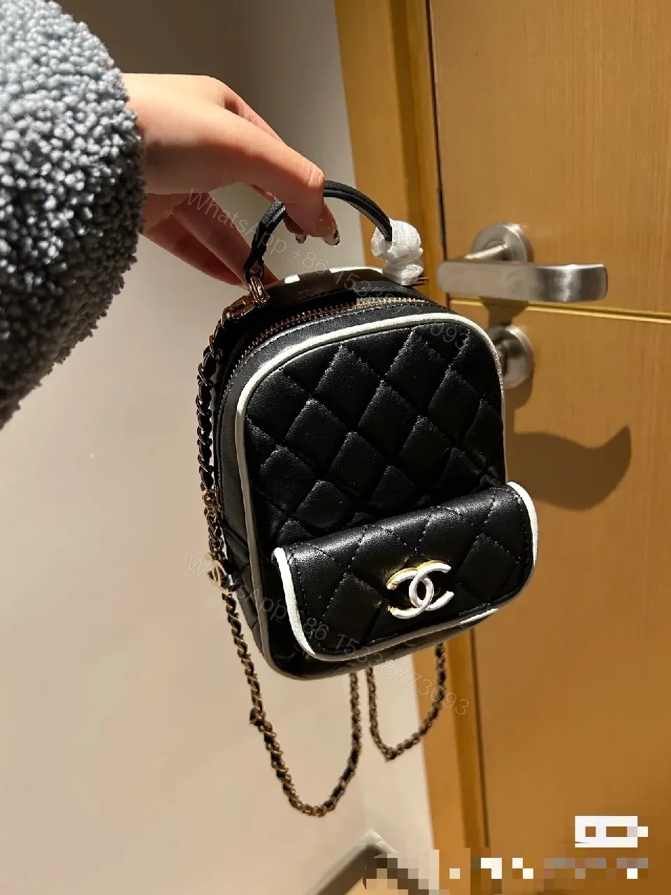 View 3 of Quilted Black Leather Mini Backpack – Luxe, Chain-strap Style
