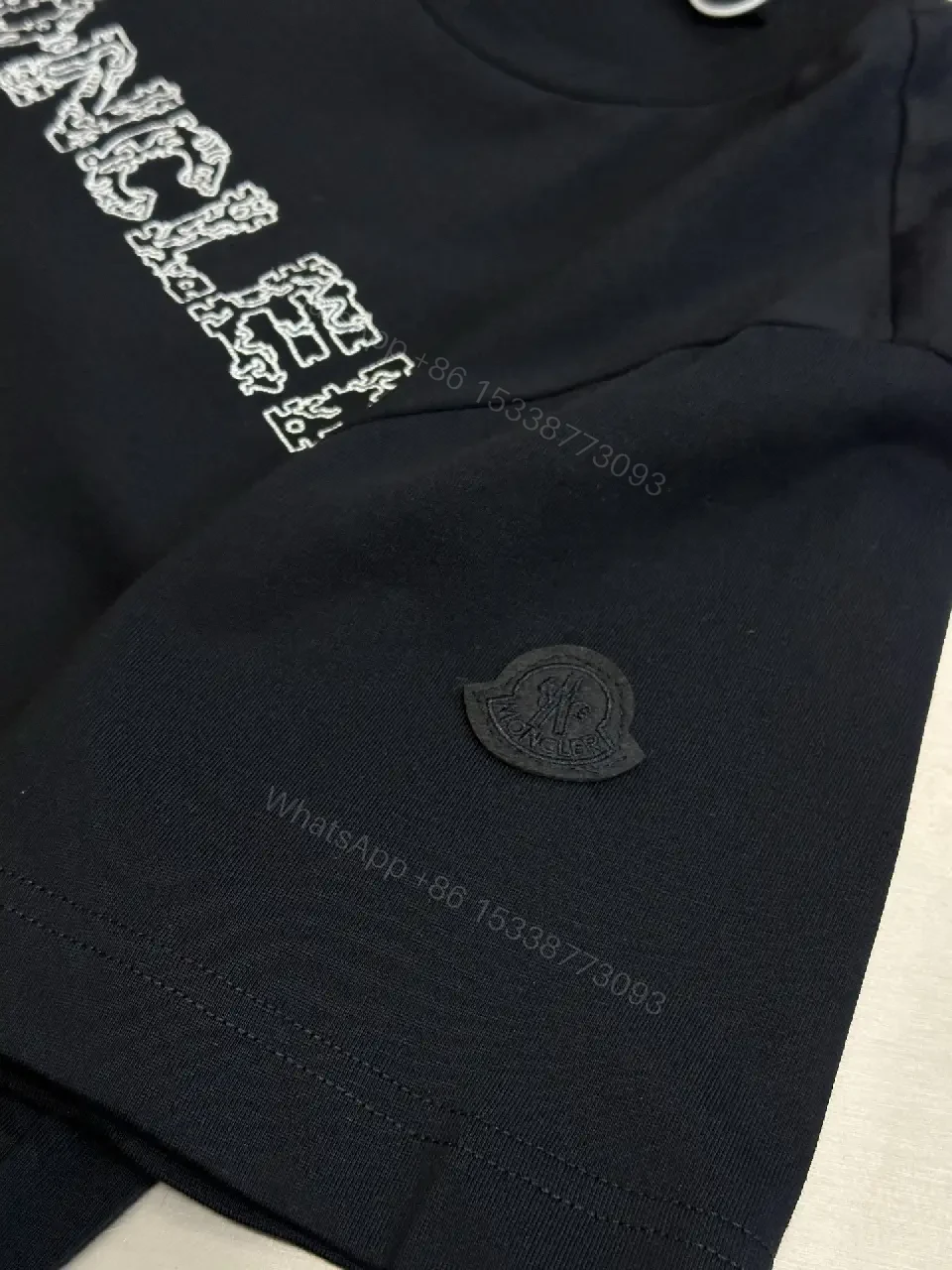 View 10 of Textured Logo Black Tee with Subtle Hardware - Premium Cotton Blend