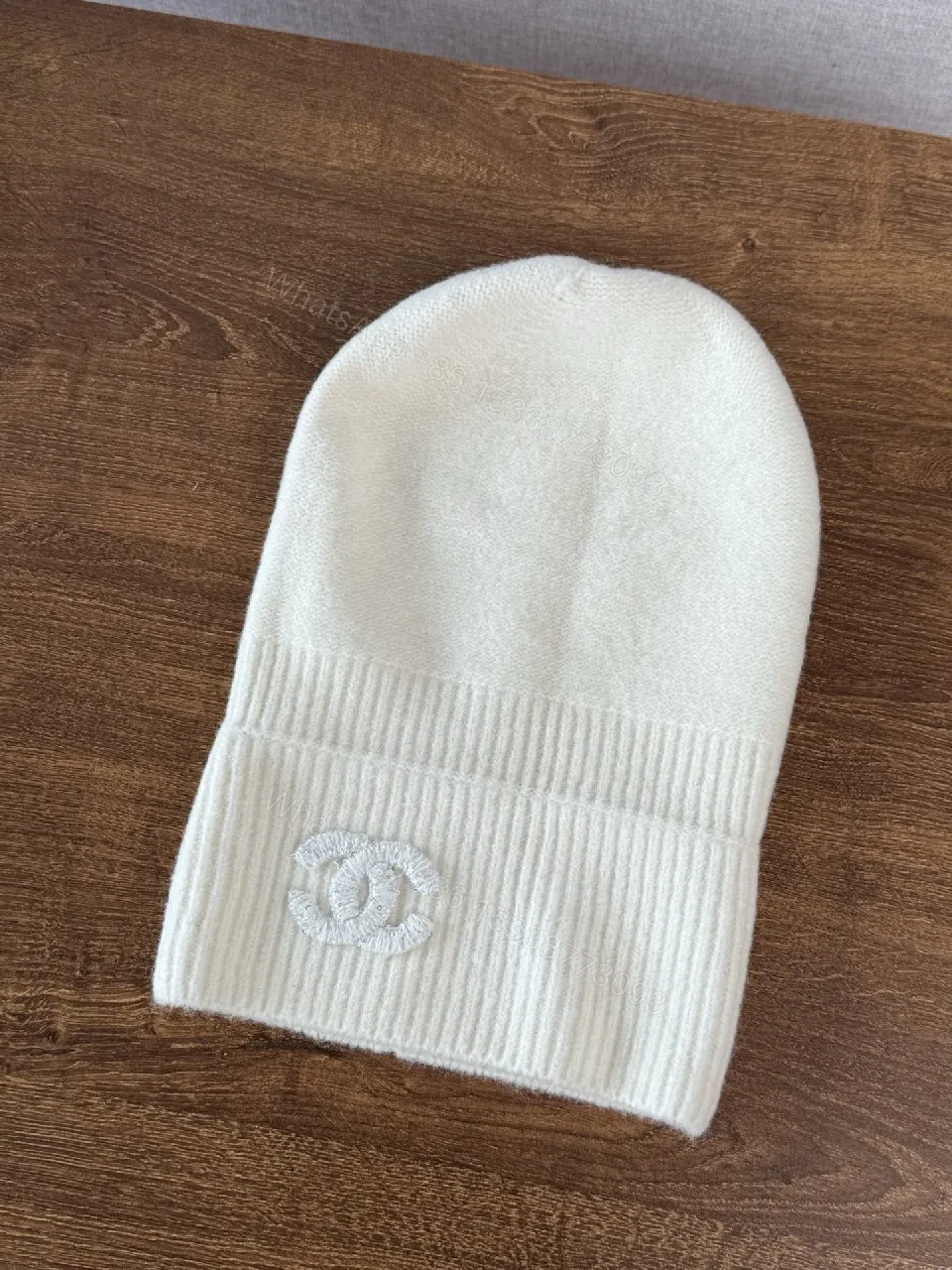View 4 of Chic Minimalism Beanie: Off-White Knit, Embroidered Logo, Everyday Luxury
