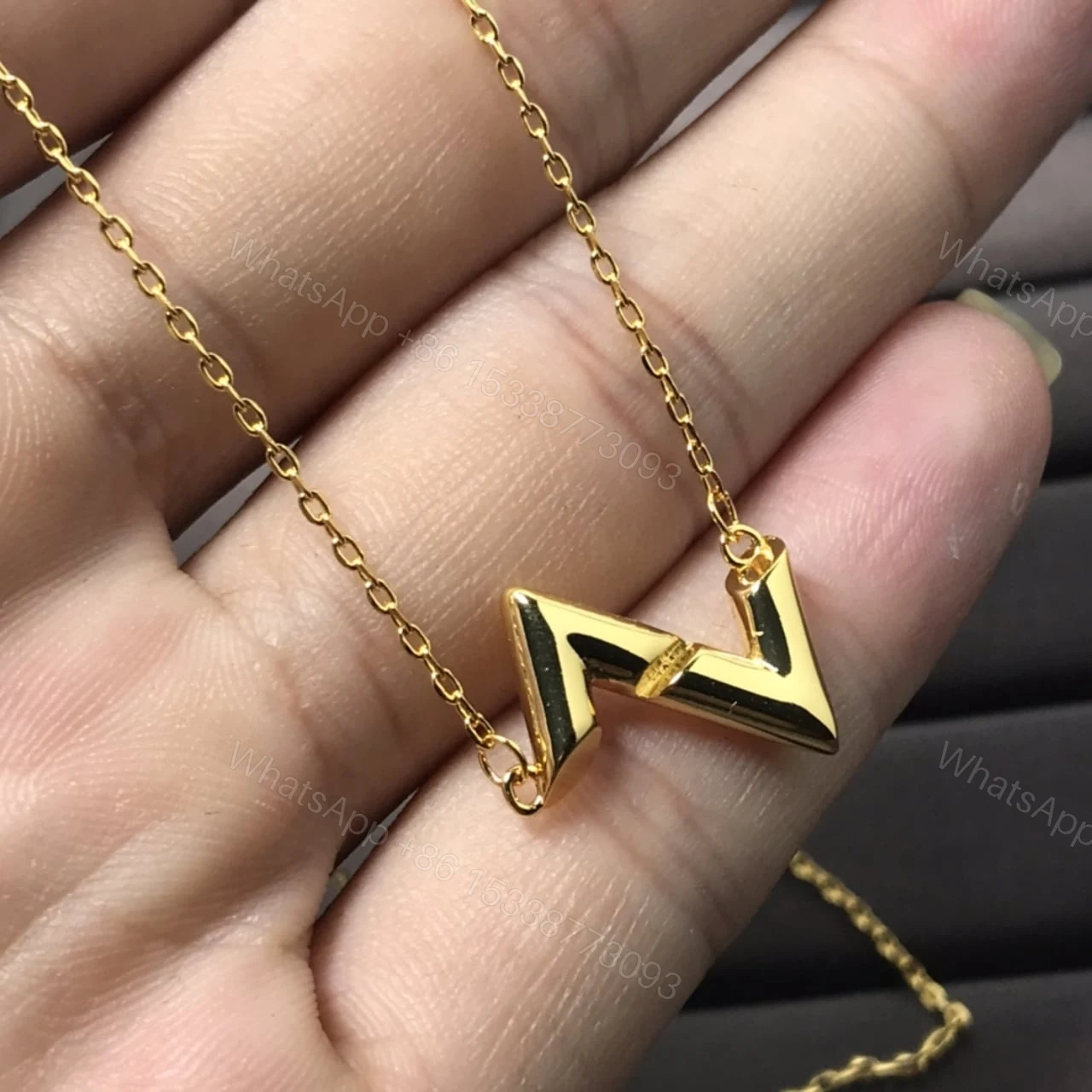 View 2 of LOUIS VUITTON VOLT UPSIDE DOWN PENDANT YELLOW GOLD NECKLACE Q93868