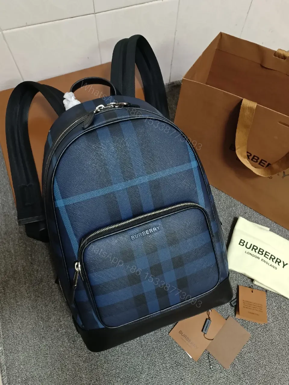 View 4 of Bold Check Pattern Leather-Accented Backpack for Everyday Luxury