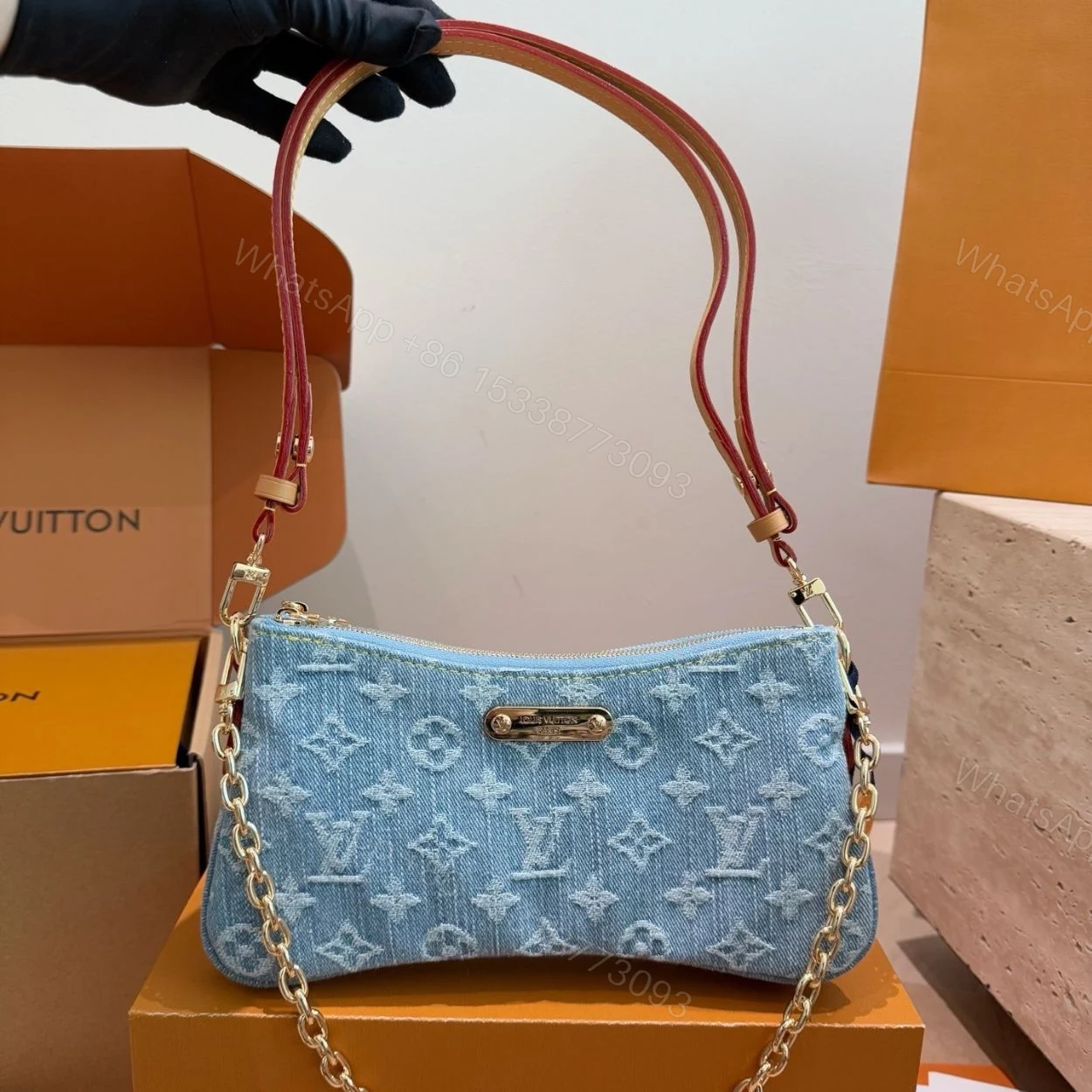 View 3 of Louis Vuitton Liv Pochette Blue Denim 25Cm M83532