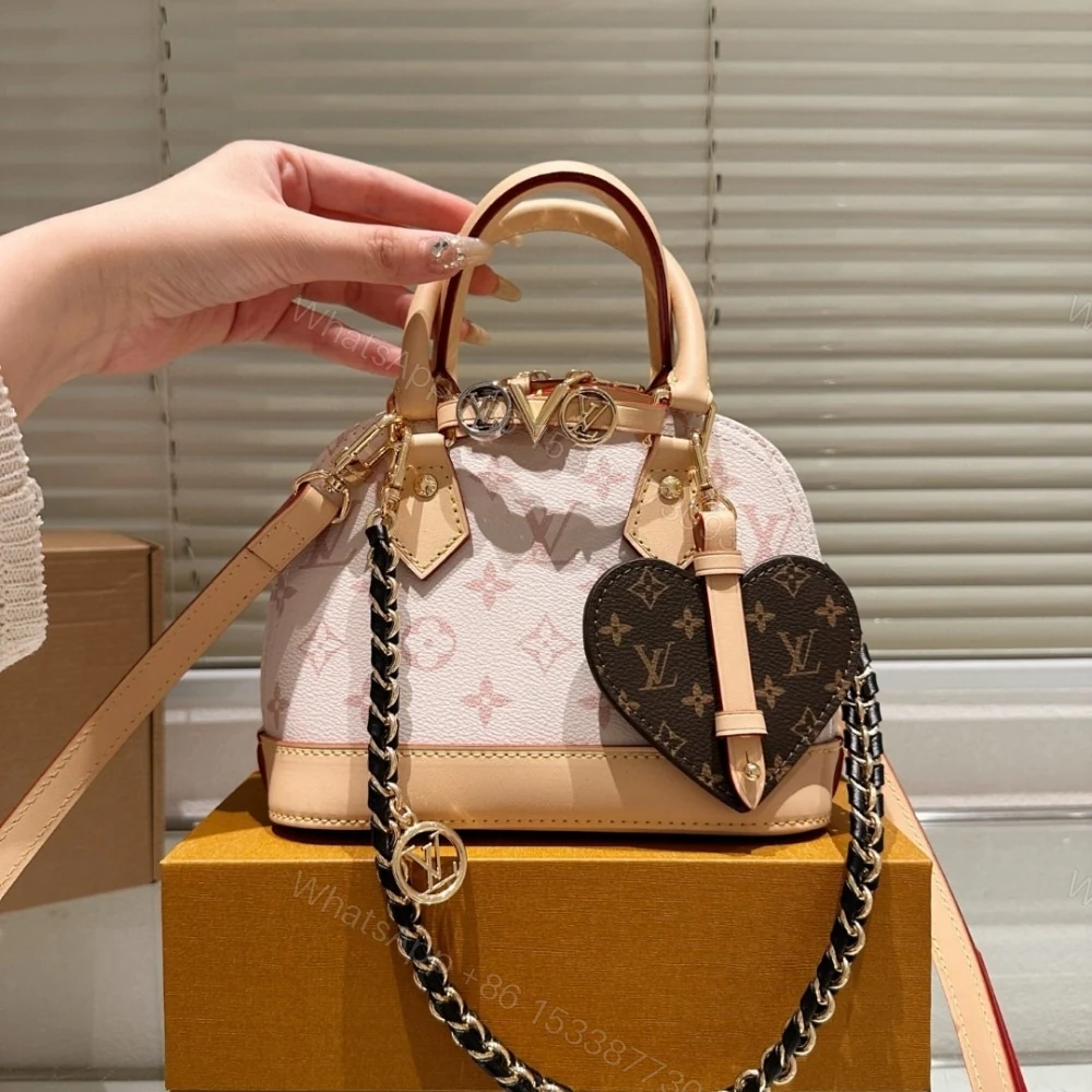 View 2 of Louis Vuitton Alma Mini LV And I Monogram Dune 25Cm K00015