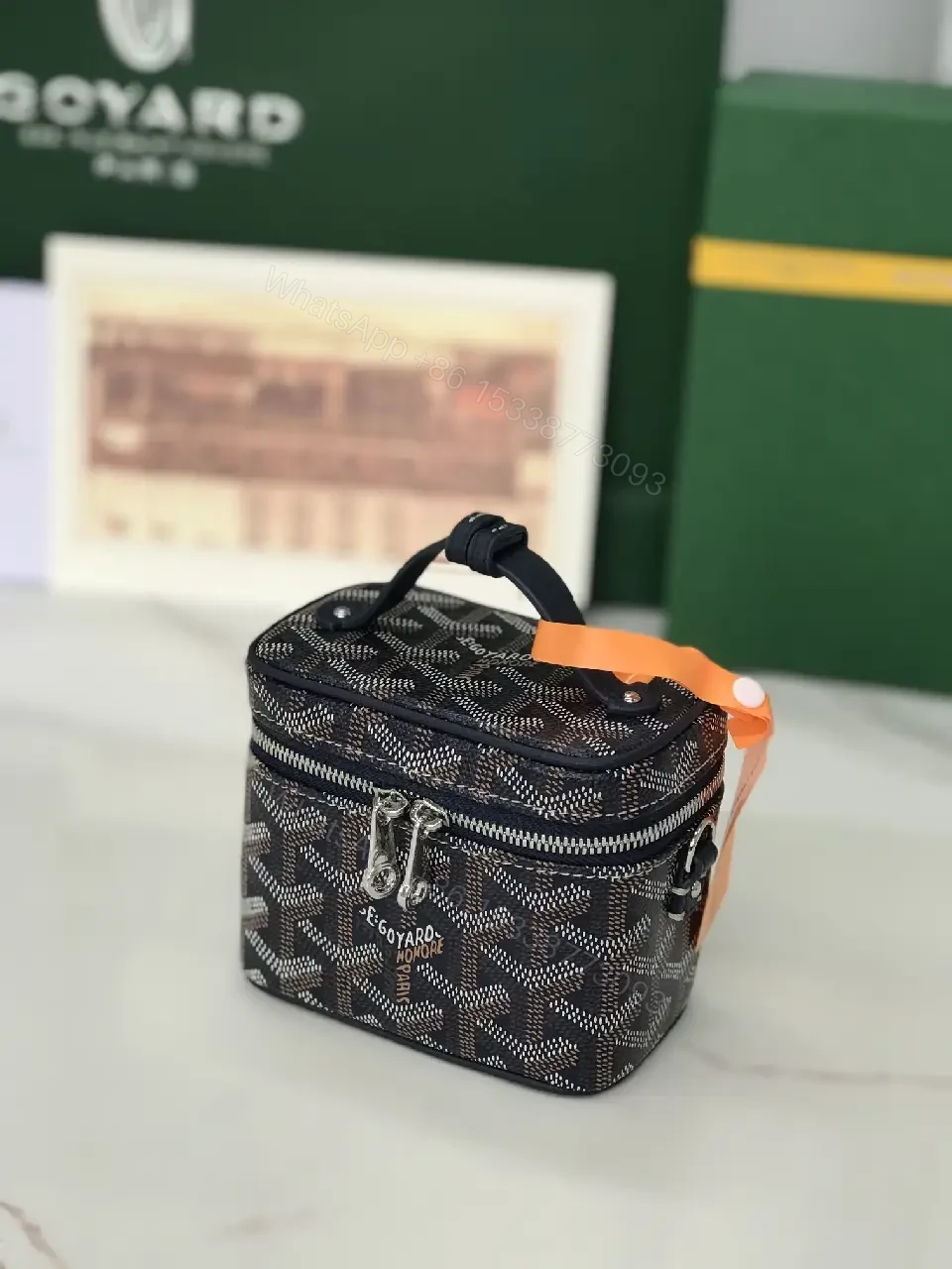 View 9 of Colorful coated-canvas pouch with distinctive pattern, compact design, durable, luxury vibe
