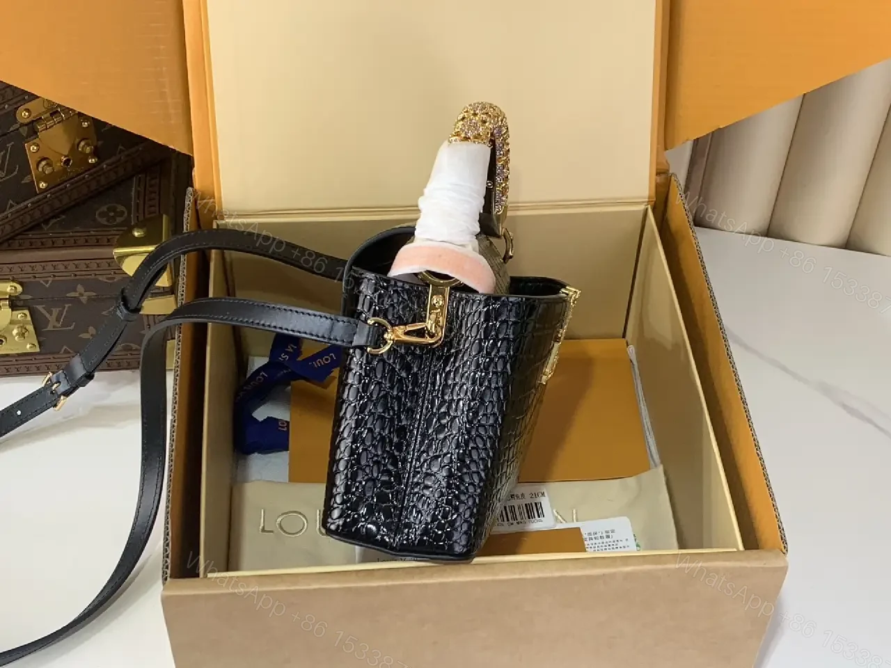 View 2 of Chic Black Crocodile-Embossed Mini Handbag with Gold Hardware