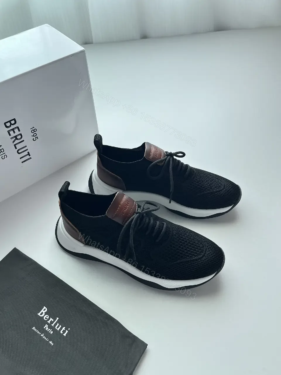 View 4 of Black knit sneakers with leather trim for everyday luxury and comfort