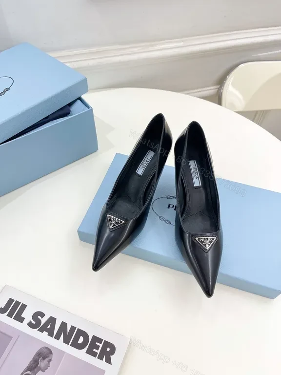 Sleek Black Leather Pumps - Prada Hardware Chelsea-Style Pumps — view 1