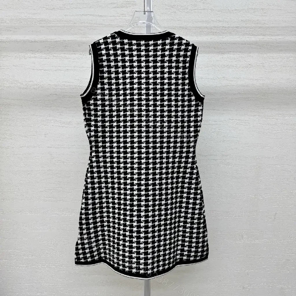 View 2 of Chic Textured Sleeveless Dress with Bold Houndstooth Pattern