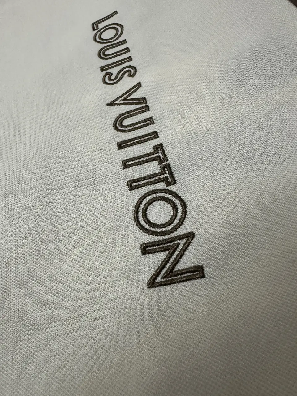 View 5 of White Cotton Polo Shirt with Black Accent Louis Vuitton Style Key Feature Pocket Short Sleeve Shirt