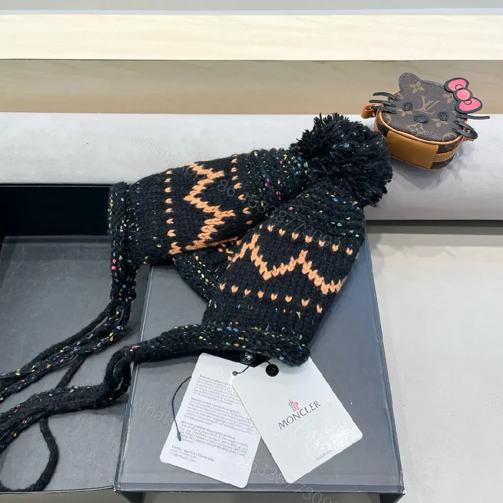 View 9 of Black Wool Earflap Beanie, Chevron Knit, Pom Pom, Signature Detail, Beanie