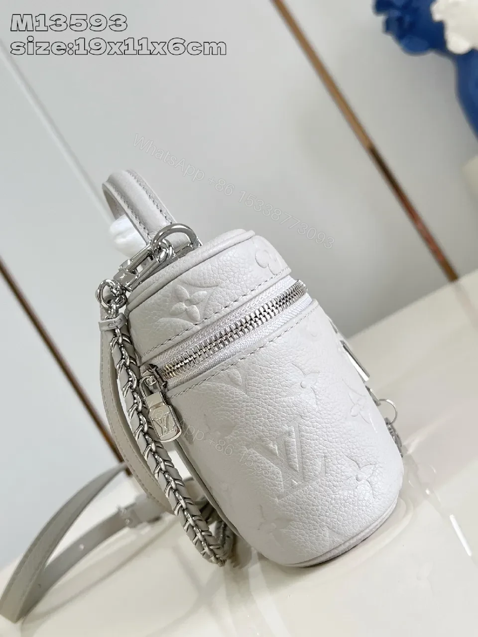 View 3 of Soft White Leather Compact Day-to-Night Bag with Textured Pattern