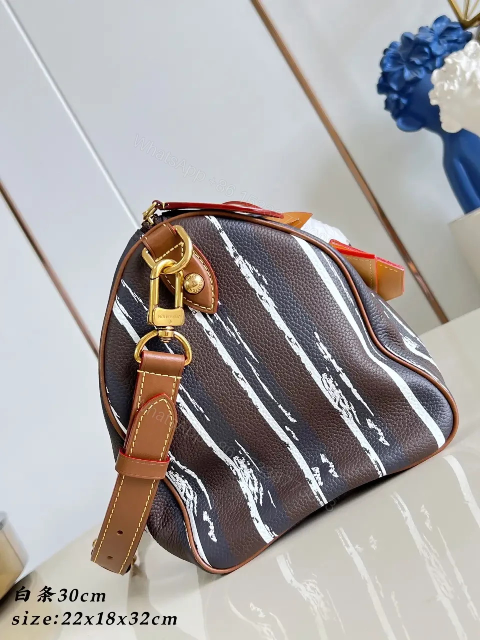 View 5 of Brown leather handbag with striped monogram pattern for luxury everyday use