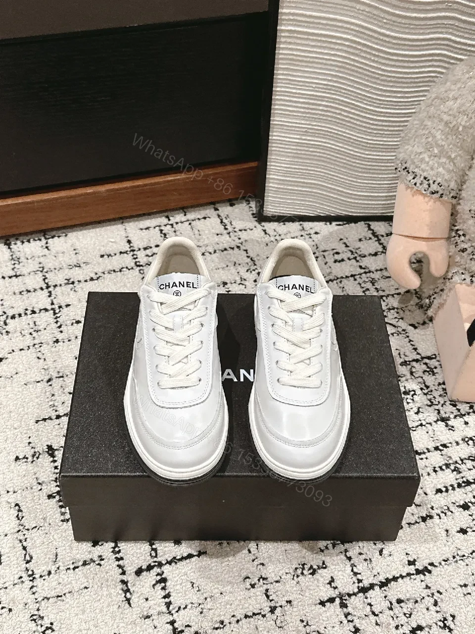 Minimalist White Leather Sneakers with Subtle Chanel Detailing — view 1
