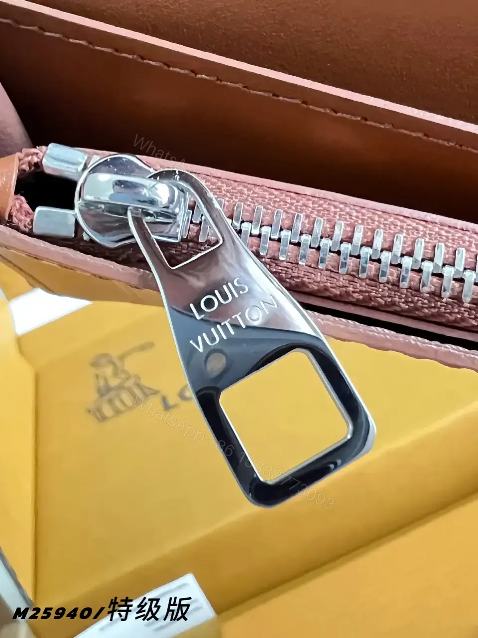 View 3 of Light Brown/Pale Pink Pebbled Leather Bi-Fold Wallet with LV Embossed Logo