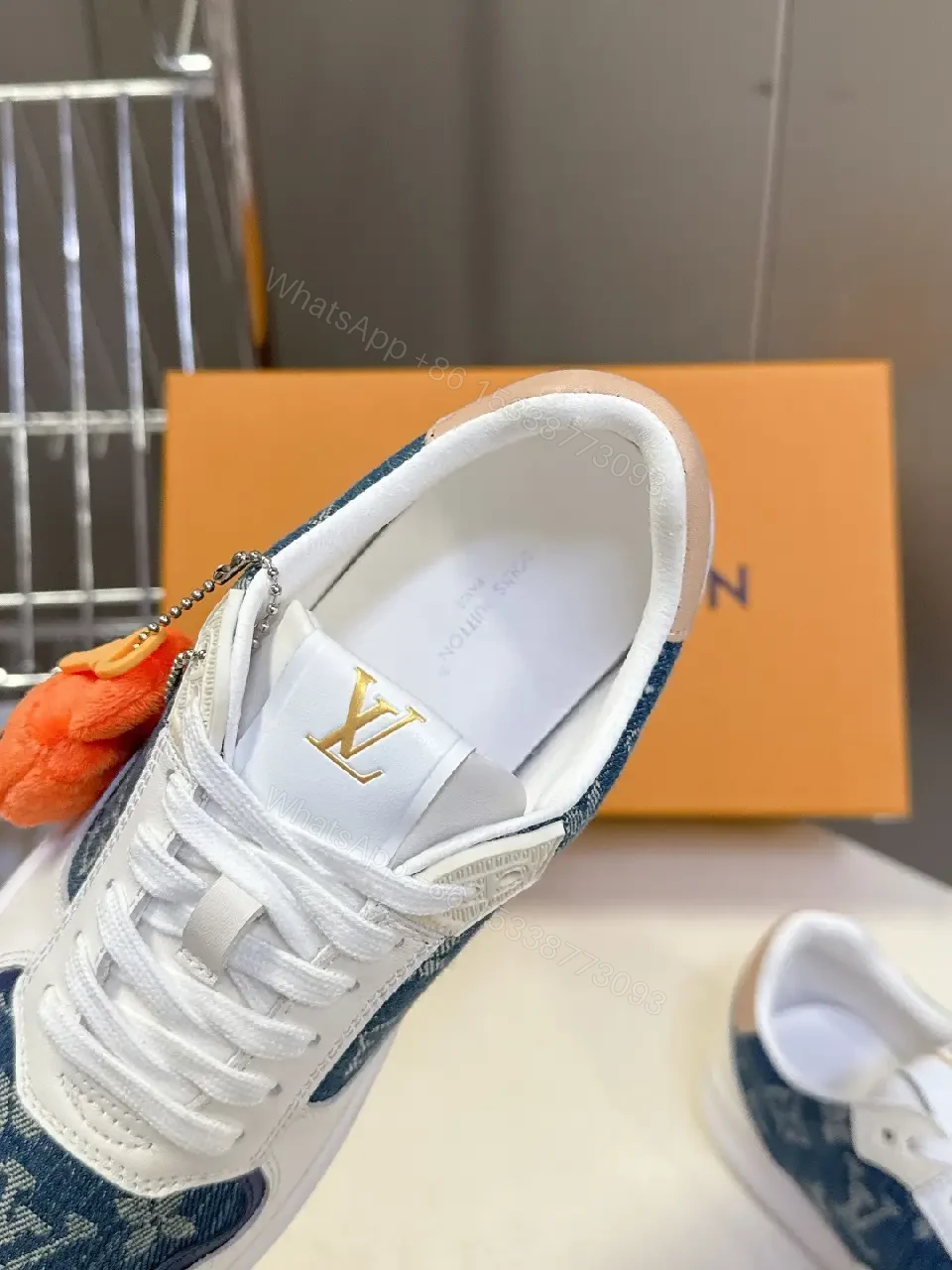 View 4 of Denim-Accent Luxury Sneakers with LV Flair