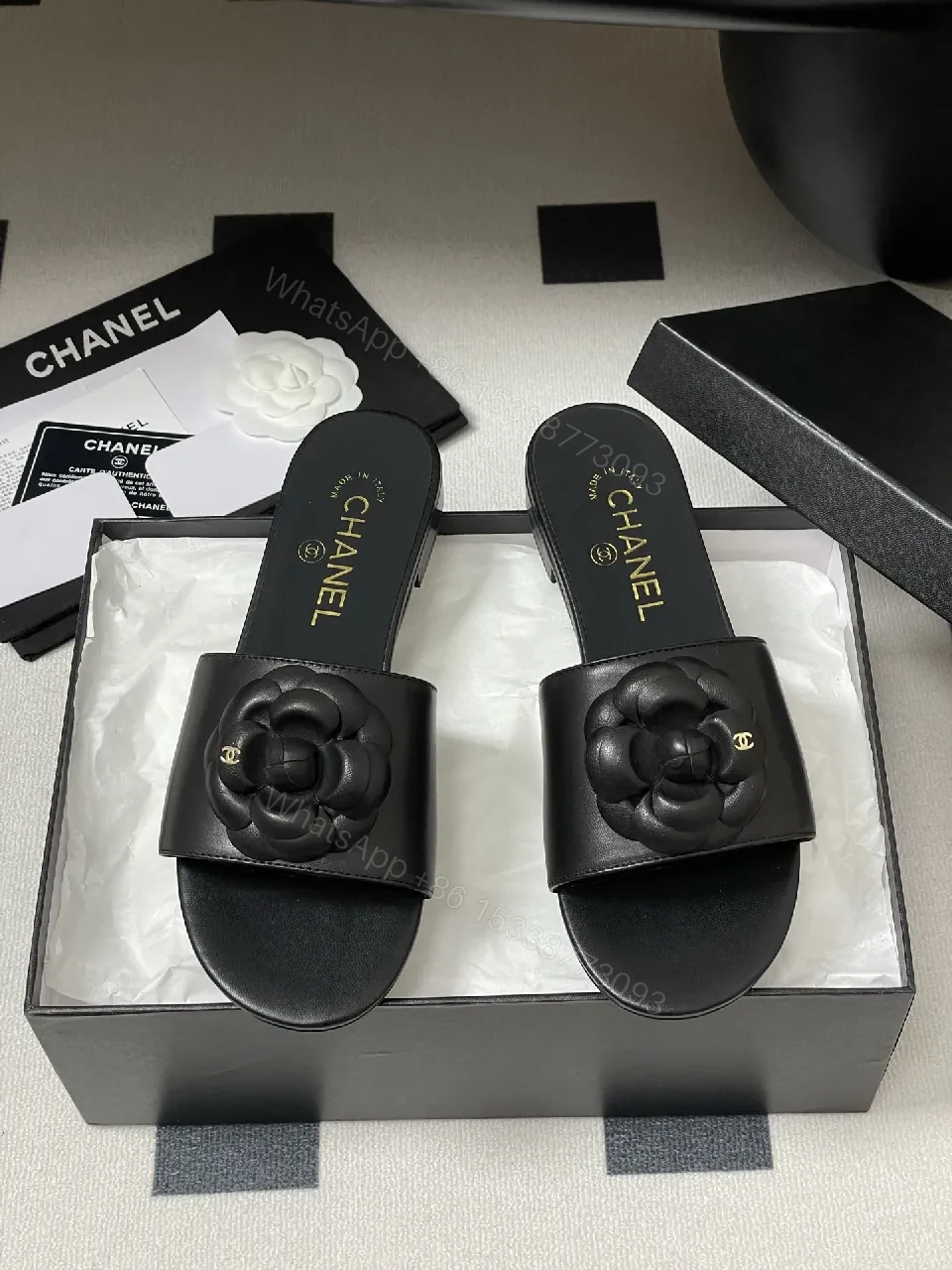 View 8 of Effortless Black Leather Slide with Camellia Detail
