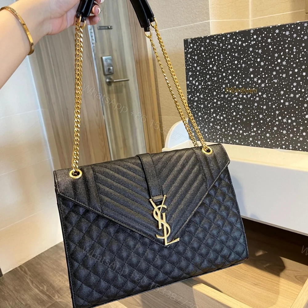 View 2 of Saint Laurent Envelope Large In Quilted Grain De Poudre Embossed Black Gold 31Cm 600166BOW911000