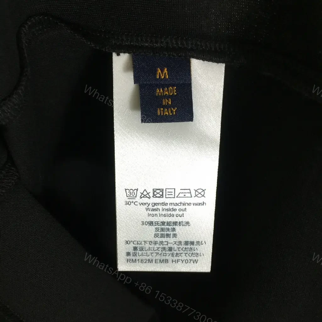 View 6 of Oversized Black Tee with Signature Embellishments — Modern Minimalism