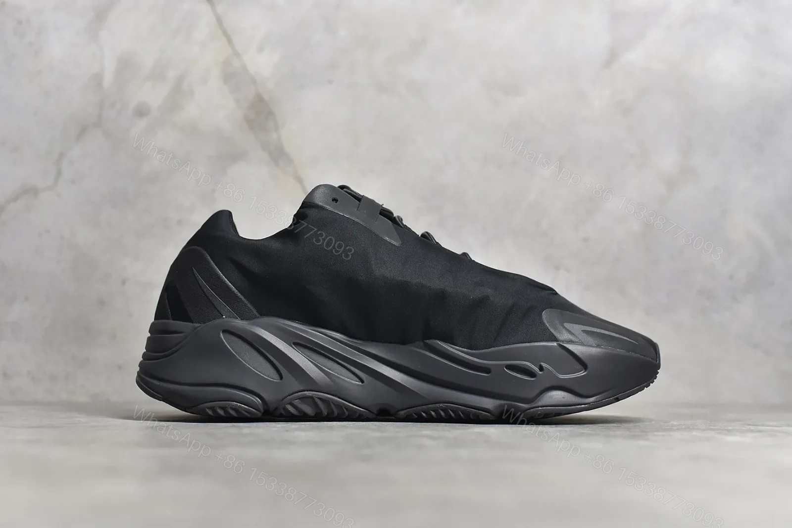 View 3 of Adidas Yeezy Boost 700 MNVN “Triple Black” Reps